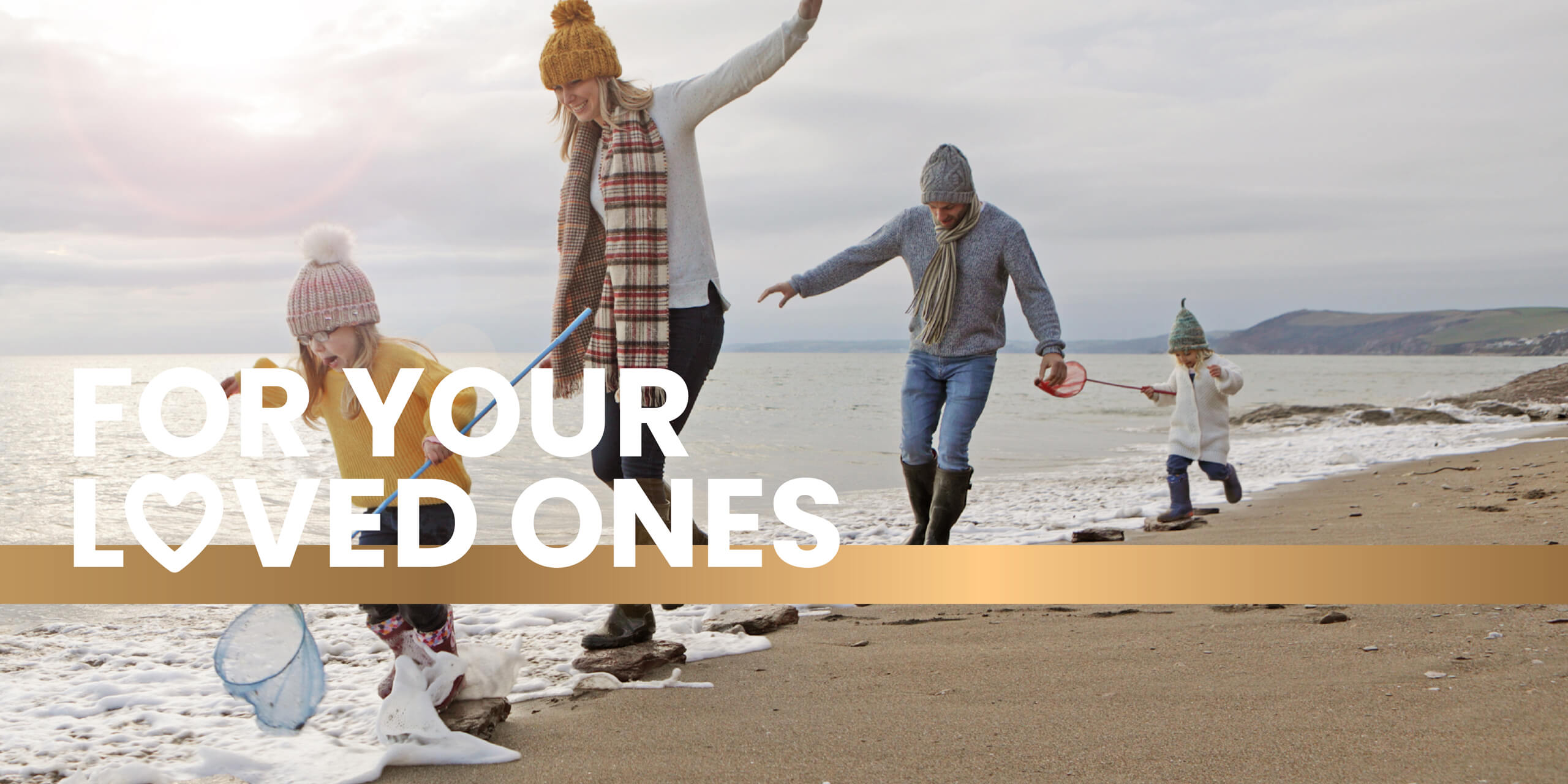 Active family enjoying outdoor activities with energy from Frisk supplements, healthy lifestyle supported by Frisk family nutrition products, banner reads 'FOR YOUR LOVED ONES'"