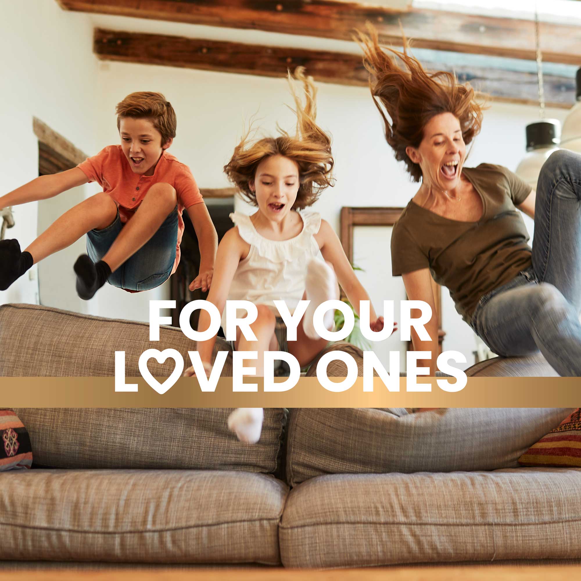 Family jumping over the couch in the living room promoting a healthy lifestyle with Frisk supplements text overlay reads “For your loved ones”