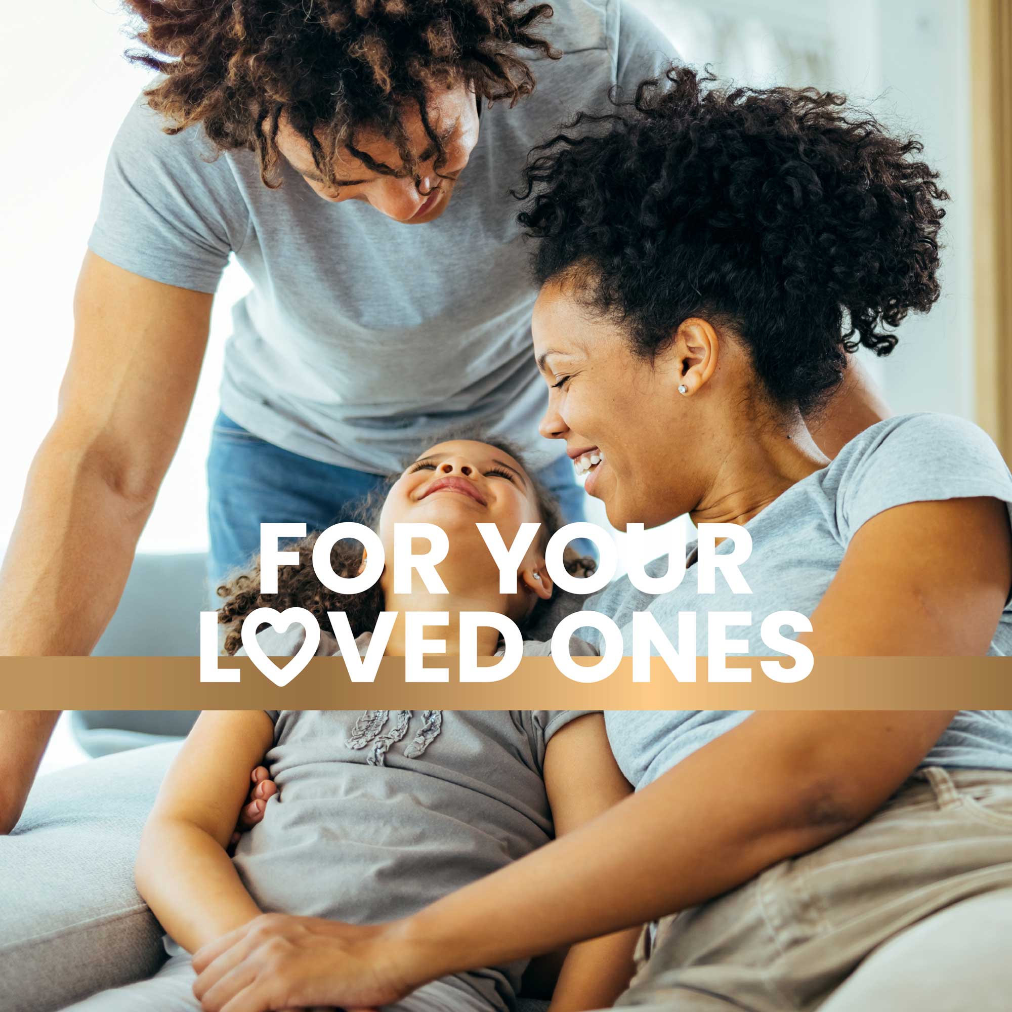 A happy family of three sits together, relaxed and smiling, radiating joy and togetherness while promoting a healthy lifestyle. Text overlay reads "For your loved ones."